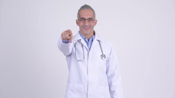 Happy Persian Man Doctor Pointing at Camera