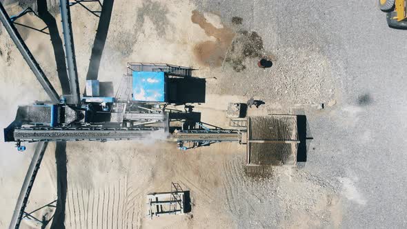 Crushing Machine Working with Breakstones at a Mining Site.