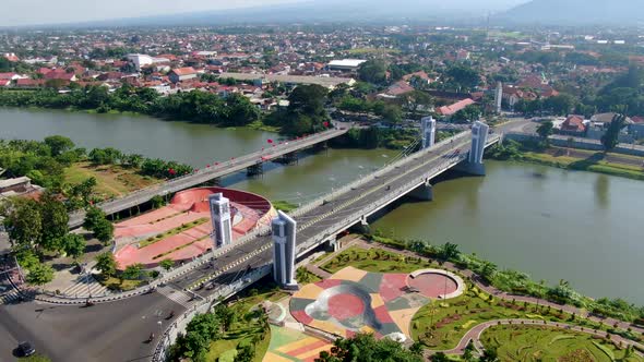 Aerial panorama of Kediri city in East Java with skate park and Brawijaya bridge