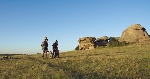 The Family Goes on a Hike with a Dog