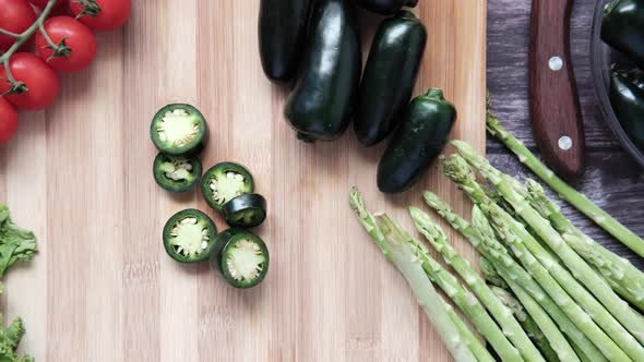 Jalapeno Peppers  Asparagus Cherry Tomato Lettuce on Chopping Board