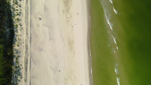 Aerial - Empty white sand Beach in Osetnik, Poland, during the Covid-19 pandemic early autumn 2020,