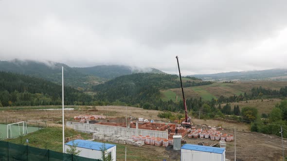 Construction site in mountains valley.