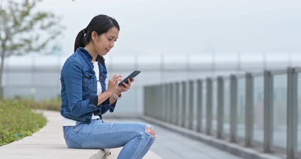 Woman use of mobile phone at outdoor