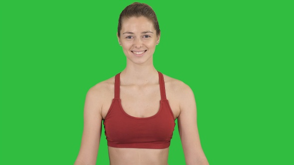 Woman practicing yoga meditation smiling on a Green Screen