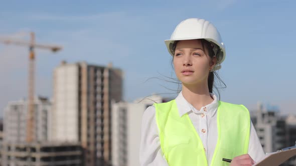 Portrait of a Female Engineer Who is Looking at the Camera
