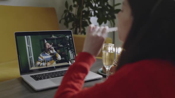 Happy Woman in Birthday Cap Celebrating Holiday Via Video Call Ogether with Her Friend During