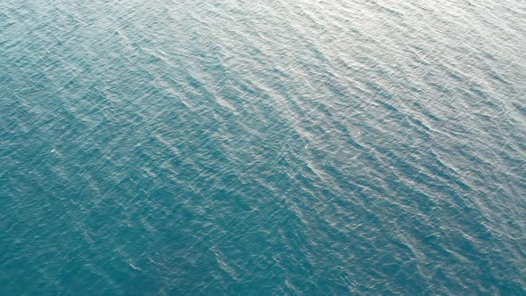 Tranquil ocean surface background footage, gentle waves of sea, aerial