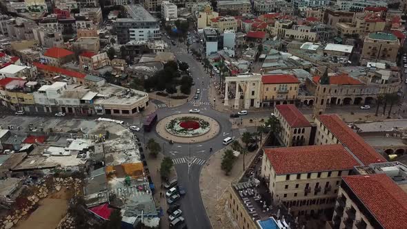 Aerial clip of the roundabout in the middle of Jaffa's inner city in Israel with the Clock Tower on