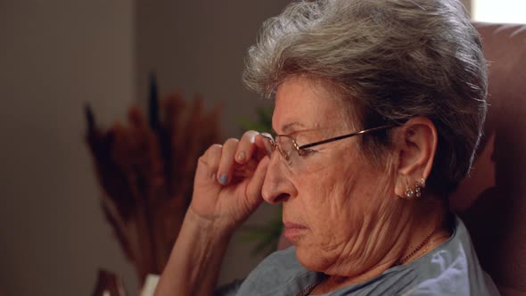 Old woman reading a book.