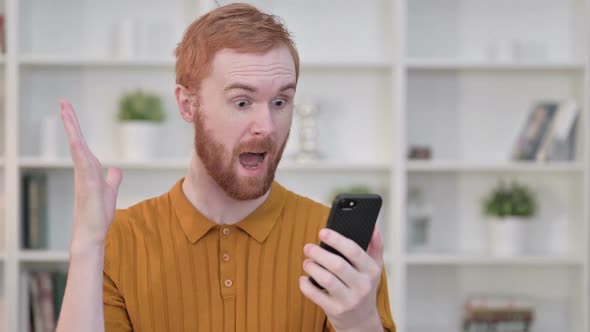 Portrait of Young Man Holding Smartphone with Chroma Screen