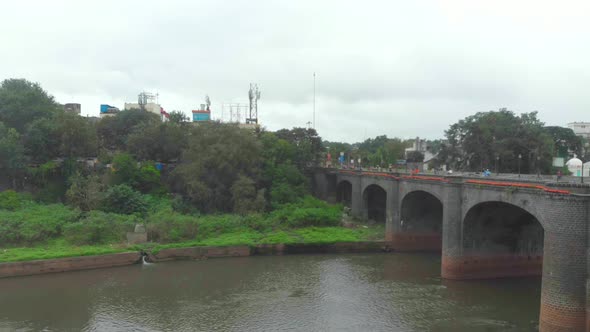 Rising drone shot over Shaniwar wada Chhatrapati Shivaji bridge road and Dr Hegdewar chowk on a clou