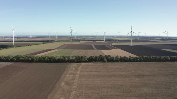 Wind turbines across agricultural field