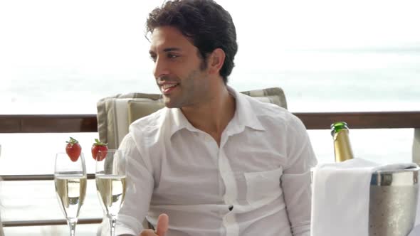 Young couple toasting champagne