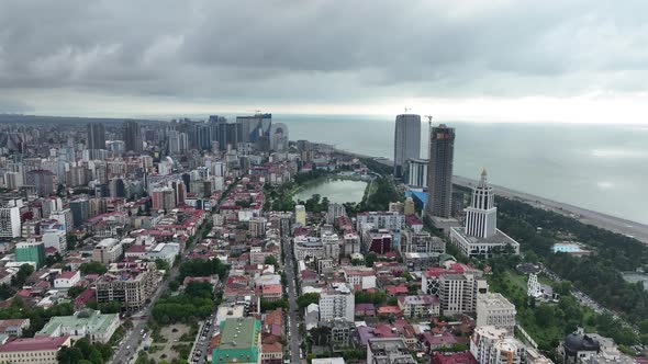 Aerial view of beautiful lake in the center of Batumi. flying over 6 May park. Georgia 2022 summer