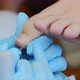 Pedicurist Master in Blue Gloves Makes Hardware Pedicure in Beauty Salon - VideoHive Item for Sale