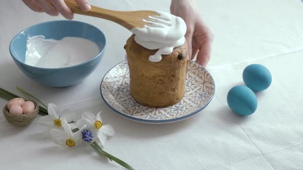 Preparing Easter cakes. Decoration sweet sugar icing sprinkled with colorful be. Happy Easter