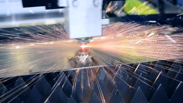 A Laser Beam Cuts the Sheet Metal in the Manufacture