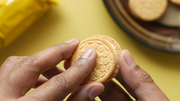 Close Up of Eating Sweet Cream Cookies