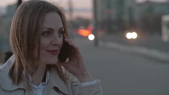 Woman Having Phone Talk on the Street