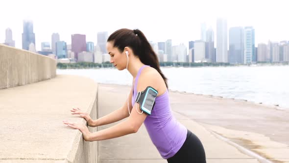 Young woman doing push up exercises