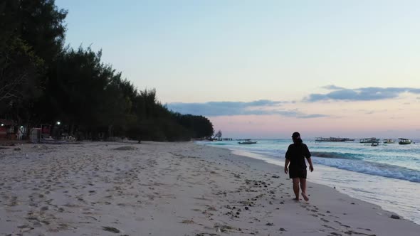 Single lady relaxing on tranquil shore beach time by shallow sea with white sand background of the M