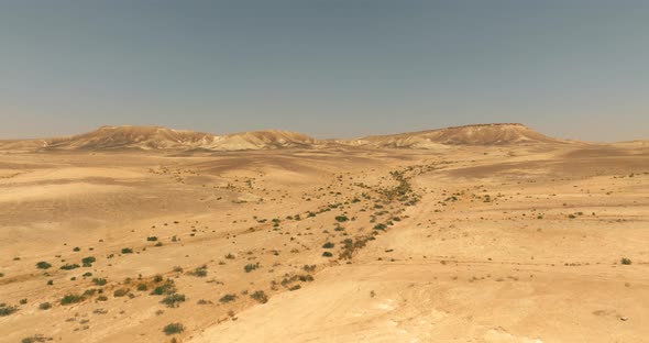 Dry Desert landscape, low pass aerial view.