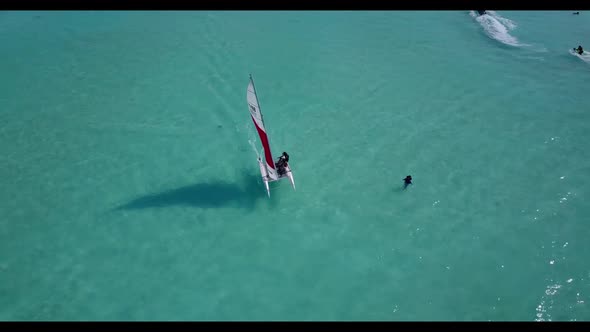Aerial flying over sky of relaxing sea view beach adventure by blue green water and white sandy back
