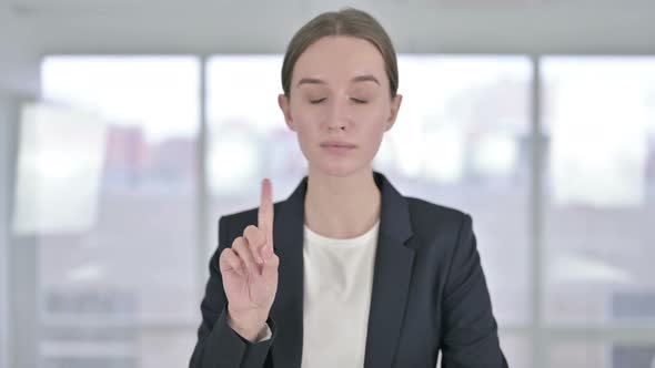 Portrait of Attractive Young Businesswoman Saying No By Finger