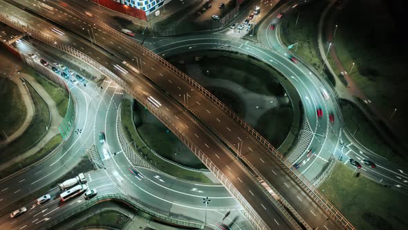 Aerial Drone Time Lapse Car Traffic Jam Roundabout Circle Interchange Road at Night Top View