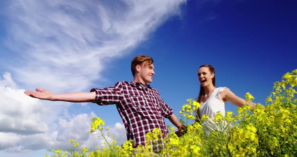 Romantic couple having fun in field