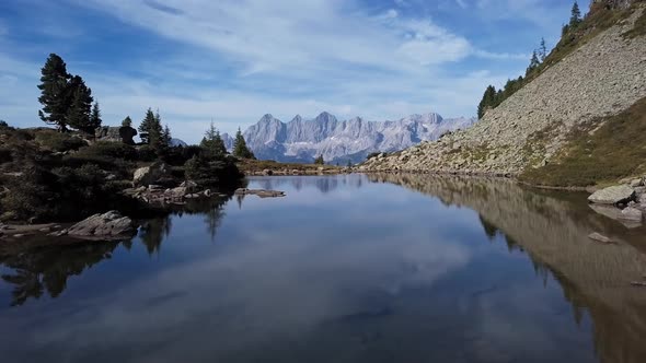 Aerial of Lake Spiegelsee with Reflections of Dachstein, Austria