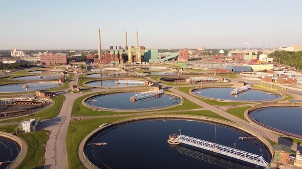 Detroit Wastewater Treatment Facility With Large Circular Sedimentation Tanks. - aerial