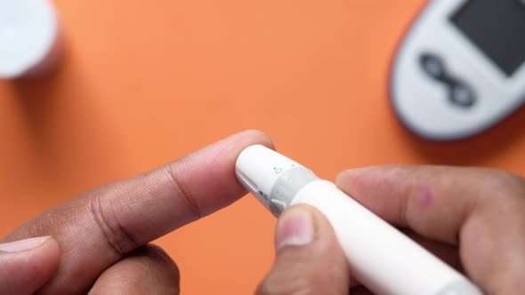 Man's Hand Measure Glucose Level Close Up 