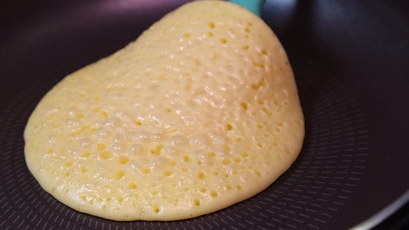 American Pancake Turning Flip To Other Side in Frying Pan with Silicone Spatula