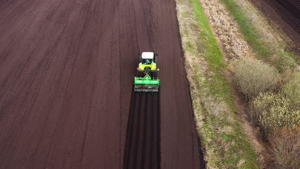 Tractor with Seeder in the Field