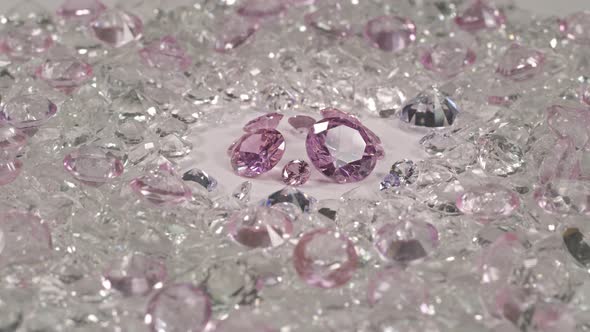 A Pile Of Pink Diamonds Placed On A White Background.