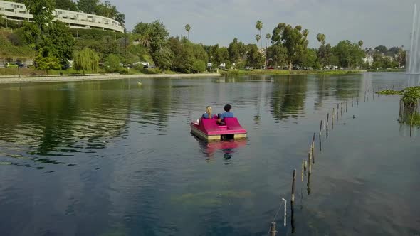 Cute Couple Enjoying A Boat Ride In The Park