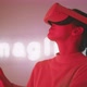 Young woman smiling and waving with hands while experiencing virtual reality wearing goggles - VideoHive Item for Sale