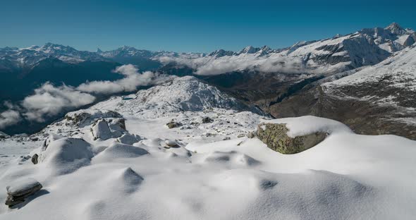 Timelapse View of a Forest Covered with Fresh Snow and Clouds in the Aletsch Arena Area