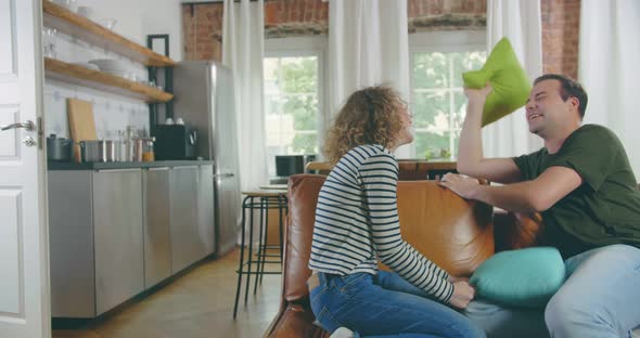 Couple Having a Fun While Pillow Fight