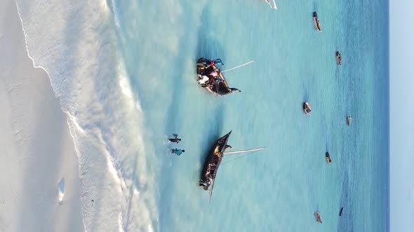 Vertical Video Boats in the Ocean Near the Coast of Zanzibar Tanzania Aerial View