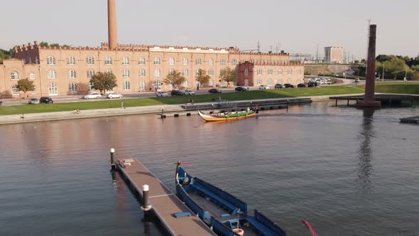 Tourists enjoying tour, traditional boat moliceiro cruise on canals of Ria de Aveiro Lagoon