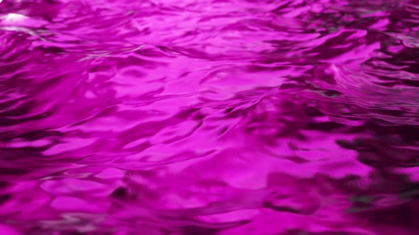 Pure Purple Water in the Pool with Light Reflections