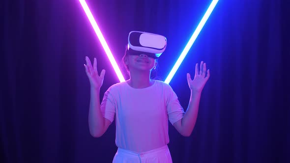 Vr, Futuristic, Excited Asian Young Girl Using Virtual Reality Headset With Neon Light