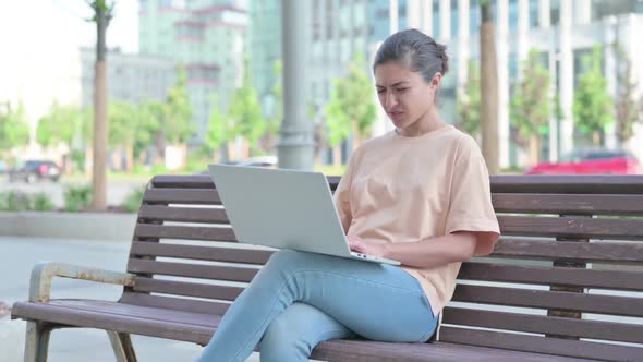 Indian Woman Having Headache While Working on Laptop