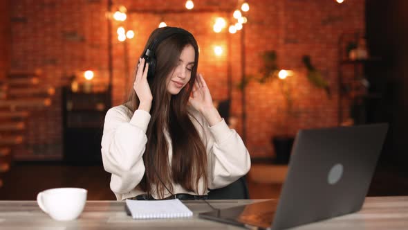 A Woman is Sitting in Her Home Office