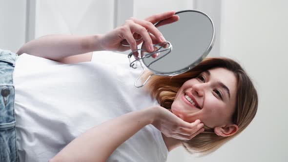Skin Care Morning Routine Woman Looking in Mirror