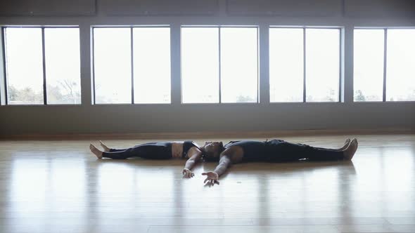 Partner Yoga performance done by two professional instructors