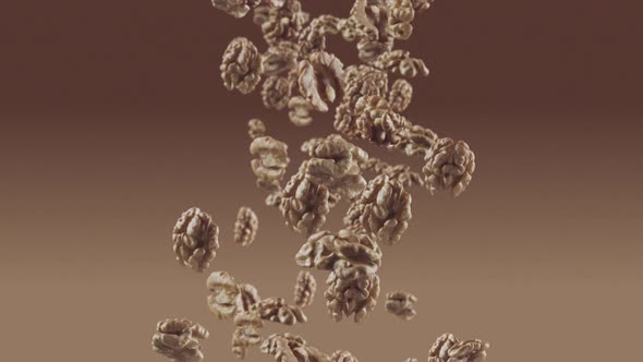 Falling of Walnuts in Brown Background